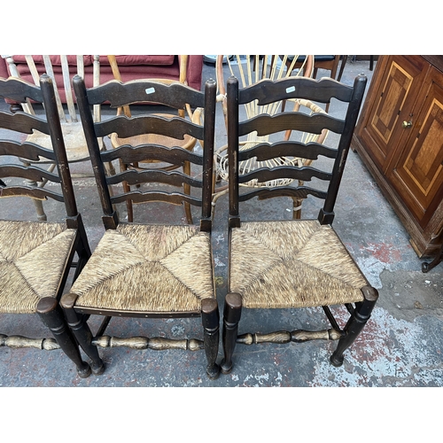 226 - Five 19th century style elm ladder back dining chairs with rush seats