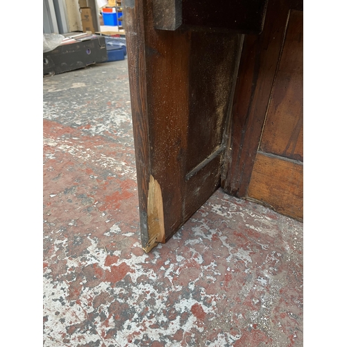 230 - An early 20th century pine church pew - approx. 85cm high x 165cm wide x 50cm deep