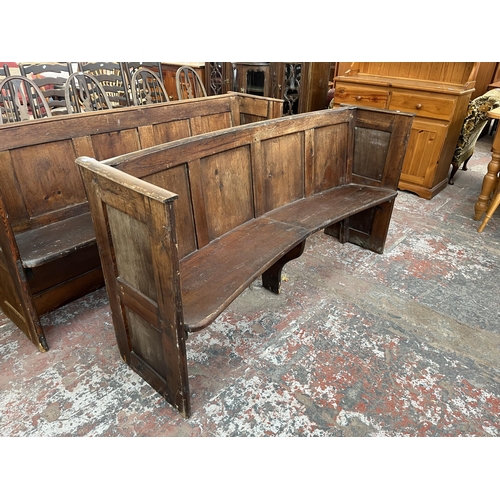 232 - An early 20th century pine curved church pew - approx. 85cm high x 165cm wide x 45cm deep