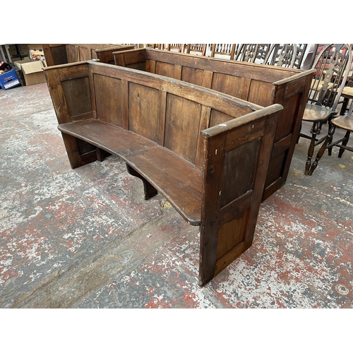 232 - An early 20th century pine curved church pew - approx. 85cm high x 165cm wide x 45cm deep