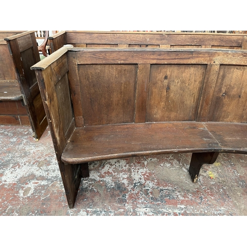 232 - An early 20th century pine curved church pew - approx. 85cm high x 165cm wide x 45cm deep