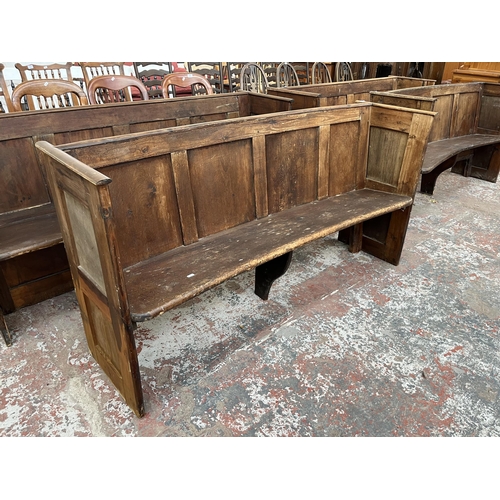 233 - An early 20th century pine curved church pew - approx. 85cm high x 164cm wide x 46cm deep