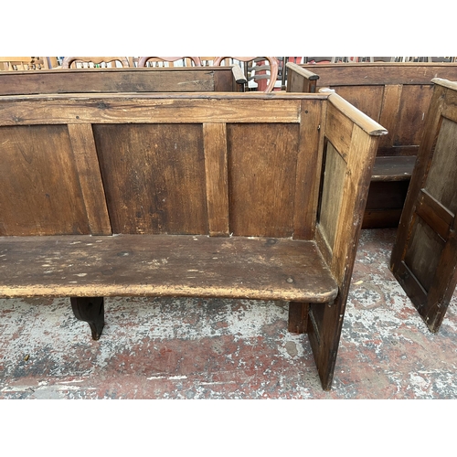 233 - An early 20th century pine curved church pew - approx. 85cm high x 164cm wide x 46cm deep