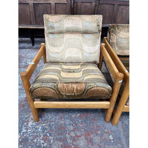 234 - A mid 20th century beech and fabric upholstered two piece lounge suite comprising three seater sofa ... 