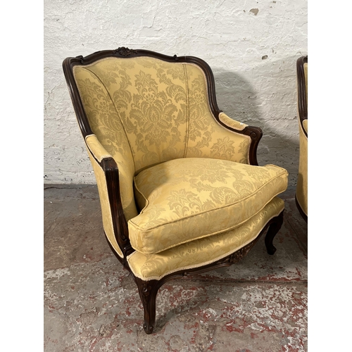 235 - A pair of Victorian style carved mahogany and floral uphosltered parlour chairs