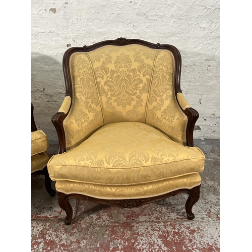 235 - A pair of Victorian style carved mahogany and floral uphosltered parlour chairs