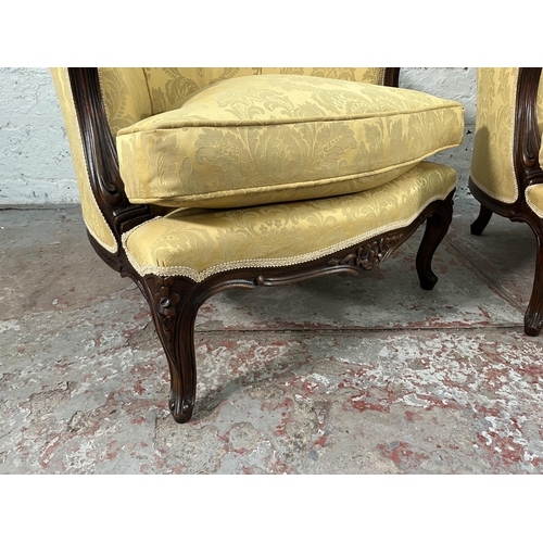 235 - A pair of Victorian style carved mahogany and floral uphosltered parlour chairs