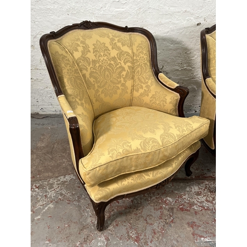 236 - A pair of Victorian style carved mahogany and floral uphosltered parlour chairs