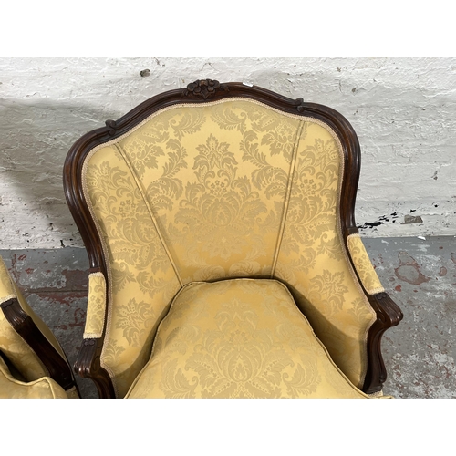 236 - A pair of Victorian style carved mahogany and floral uphosltered parlour chairs