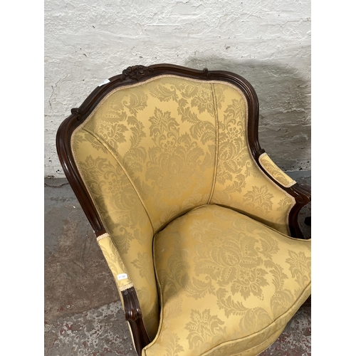 236 - A pair of Victorian style carved mahogany and floral uphosltered parlour chairs