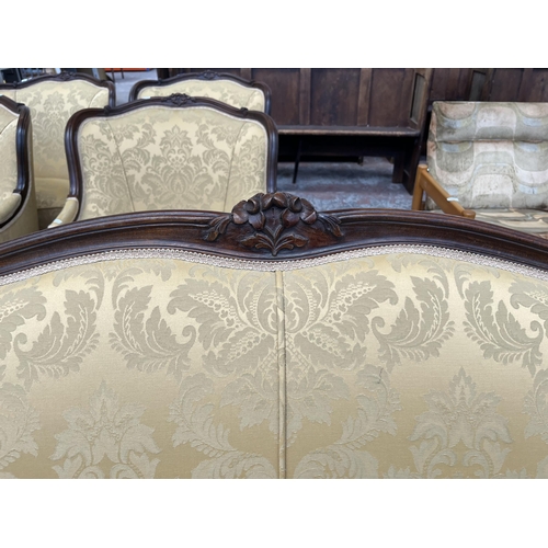 237 - A Victorian style carved mahogany and floral upholstered parlour sofa