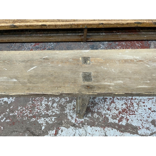 241 - An early 20th century pitch pine bench - approx. 46cm high x 27cm wide x 376cm long