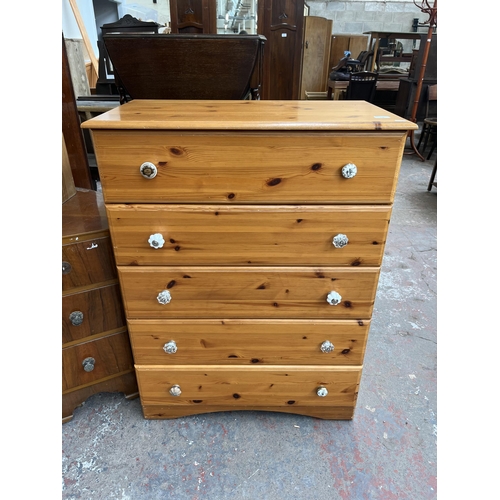 116 - A pine effect chest of five drawers