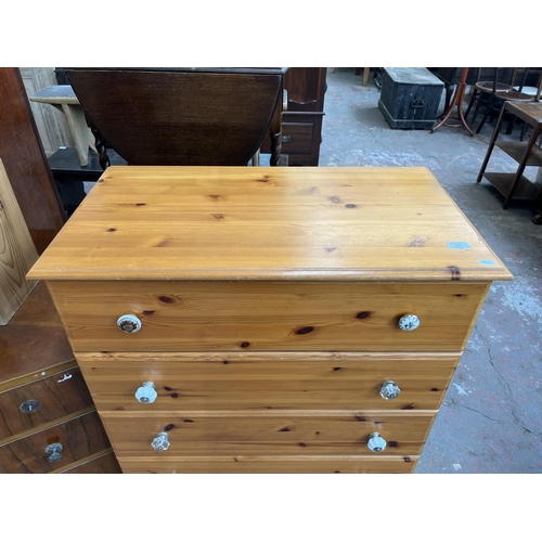 116 - A pine effect chest of five drawers