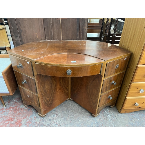 118 - An Art Deco style walnut bow fronted desk