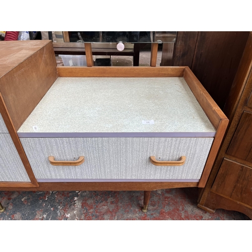 119 - A mid 20th century teak and formica dressing table