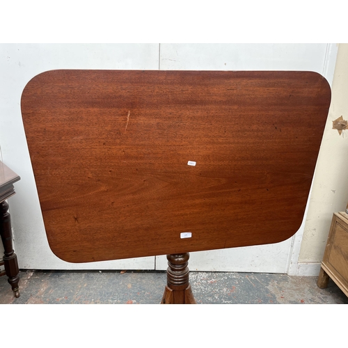 123 - A Georgian mahogany tilt top occasional table