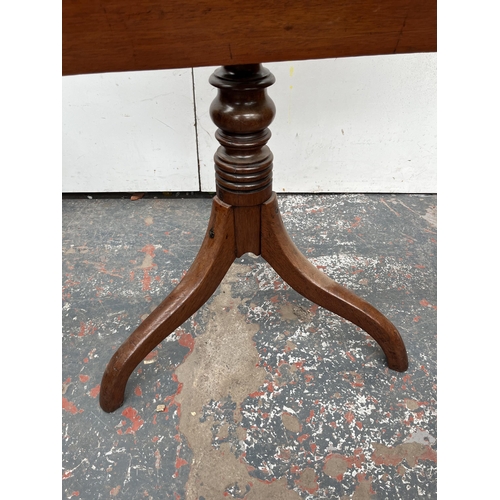 123 - A Georgian mahogany tilt top occasional table