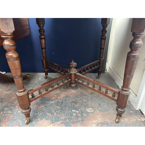 124 - A late 19th/early 20th century walnut octagonal centre table with galleried X frame stretcher - appr... 