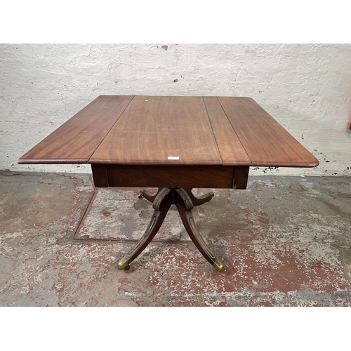 125 - A 19th century mahogany drop leaf pedestal Pembroke table