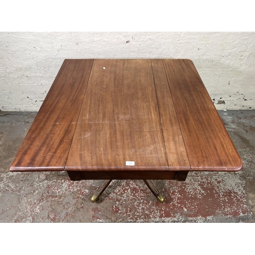 125 - A 19th century mahogany drop leaf pedestal Pembroke table