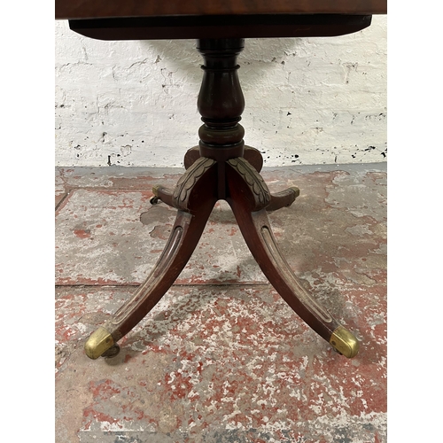 125 - A 19th century mahogany drop leaf pedestal Pembroke table