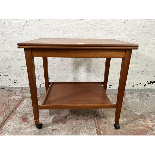 127 - A mid 20th century Eastcraft of Scotland teak swivel top card table/serving trolley - approx. 60cm h... 