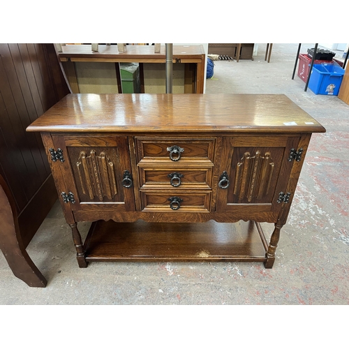 132 - An Old Charm oak linenfold side cabinet