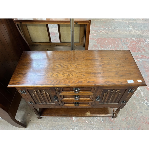 132 - An Old Charm oak linenfold side cabinet