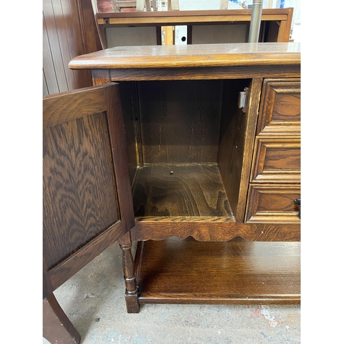 132 - An Old Charm oak linenfold side cabinet