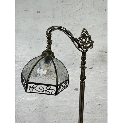 132A - A Victorian style brass effect standard lamp with glass shade - approx. 160cm high