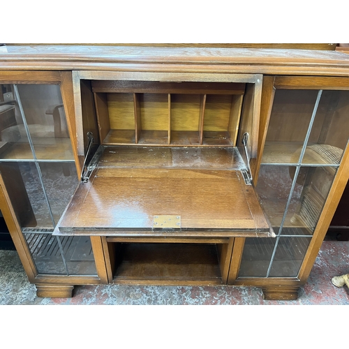 136 - A mid 20th century oak side by side bureau bookcase