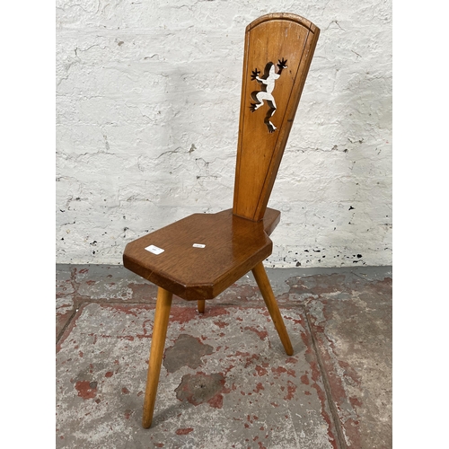 137 - A mid 20th century carved beech spinning chair