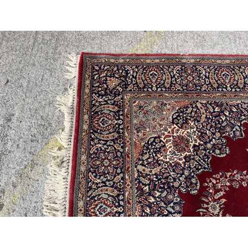 145 - A Phoenix Carpets Teheran rug - approx. 250cm x 180cm