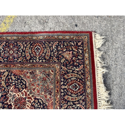 145 - A Phoenix Carpets Teheran rug - approx. 250cm x 180cm