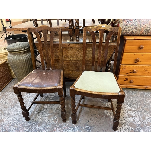 146 - An oak drop leaf gate leg oval dining table on barley twist supports and four dining chairs