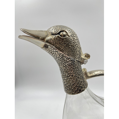 295 - A silver plate and glass duck decanter - approx. 27cm high