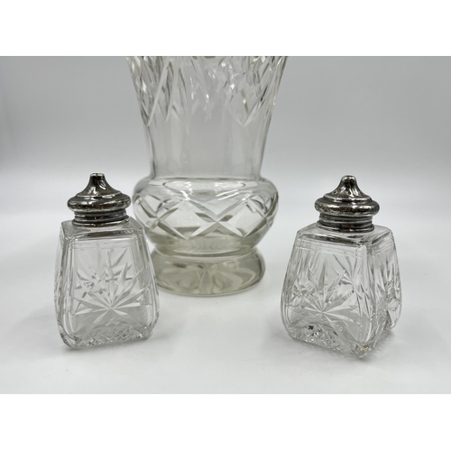 302 - Three pieces of cut glassware with hallmarked sterling silver tops, two salt and pepper shakers and ... 