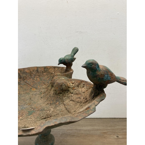 364 - A cast iron scalloped shaped bird bath on pedestal base - approx. 49cm high x 39cm wide