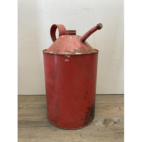 366 - Three mid 20th century items, two enamelled paraffin heaters and one red painted galvanized oil can