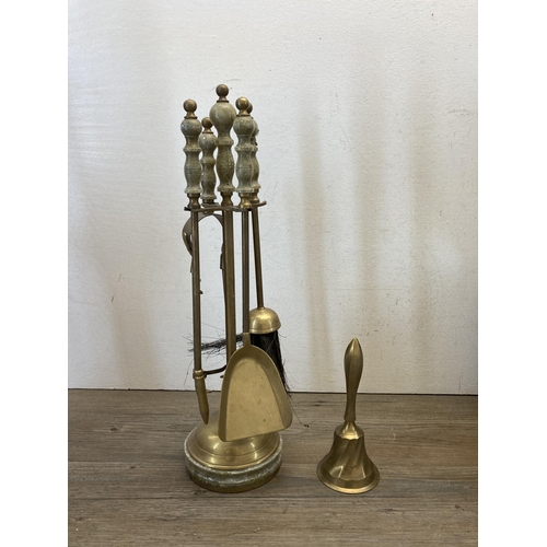 369 - A collection of 19th century and later metalware to include copper fire fender, fire companion set, ... 