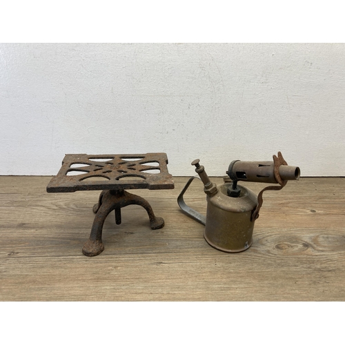 379 - Five 19th century and later pieces of metalware to include two cast iron flat irons, Sievert brass b... 