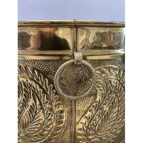 381 - An embossed and hammered brass log bucket - approx. 29cm high x 43cm diameter