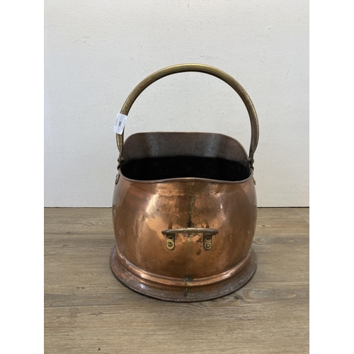 384 - A 19th century copper and brass coal scuttle - approx. 44cm high