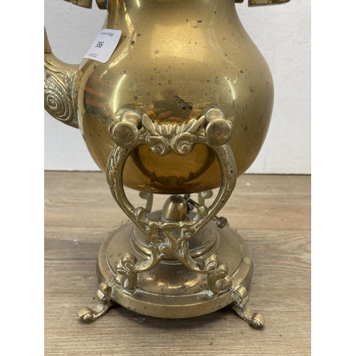 386 - A late 19th/early 20th century brass spirit kettle on stand - approx. 40cm