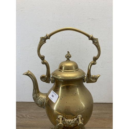 386 - A late 19th/early 20th century brass spirit kettle on stand - approx. 40cm