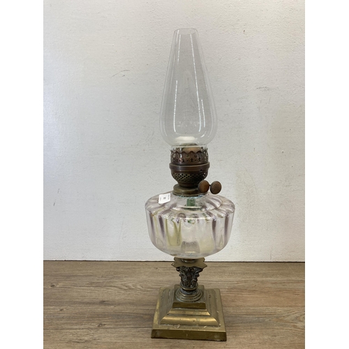 387 - Three 19th century and later oil lamps - largest approx. 55cm high