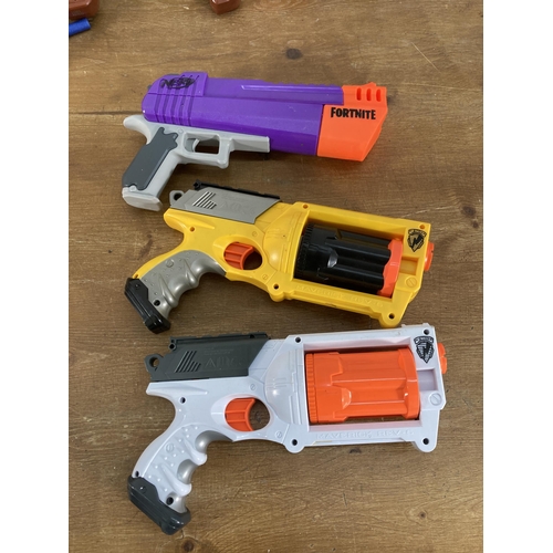 393 - A large collection of various Nerf guns