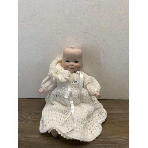 395 - A BMS four faced porcelain doll