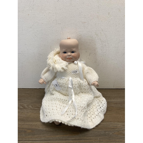 395 - A BMS four faced porcelain doll